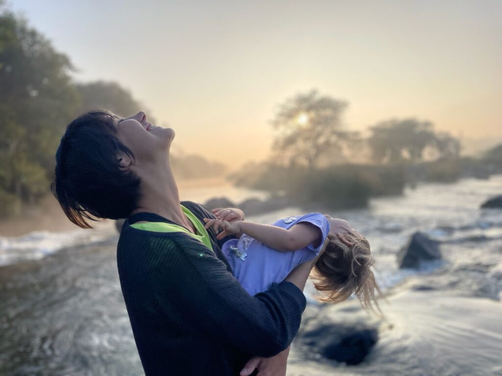 Mum and daughter laughing on the Cauvery river